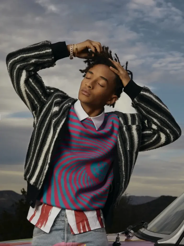 formal outfit which features psychedelic patten sweater and vertical patten black and white sweater