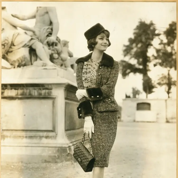 vintage image of woman wearing chanel tweed jacket with its complementary skit