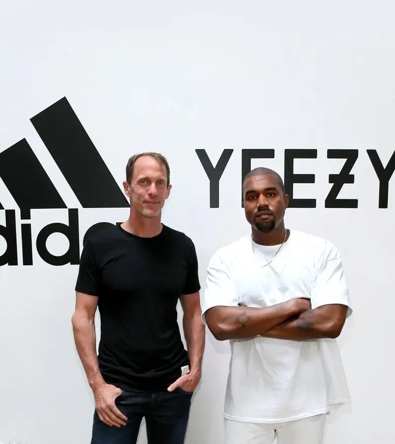 kanye west standing next to the adidas cmo eric liedtke when the collaboration of yeexy and adidas was unveiled