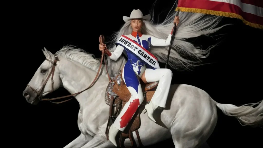 Beyonce cowboy Carter campaign image with her wearing a white cowboy outfit, while sitting a white horse and waving the American flag