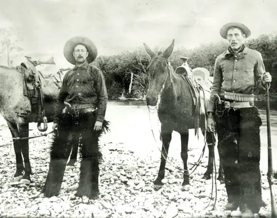 vintage photo of American cowboys with their donkeys