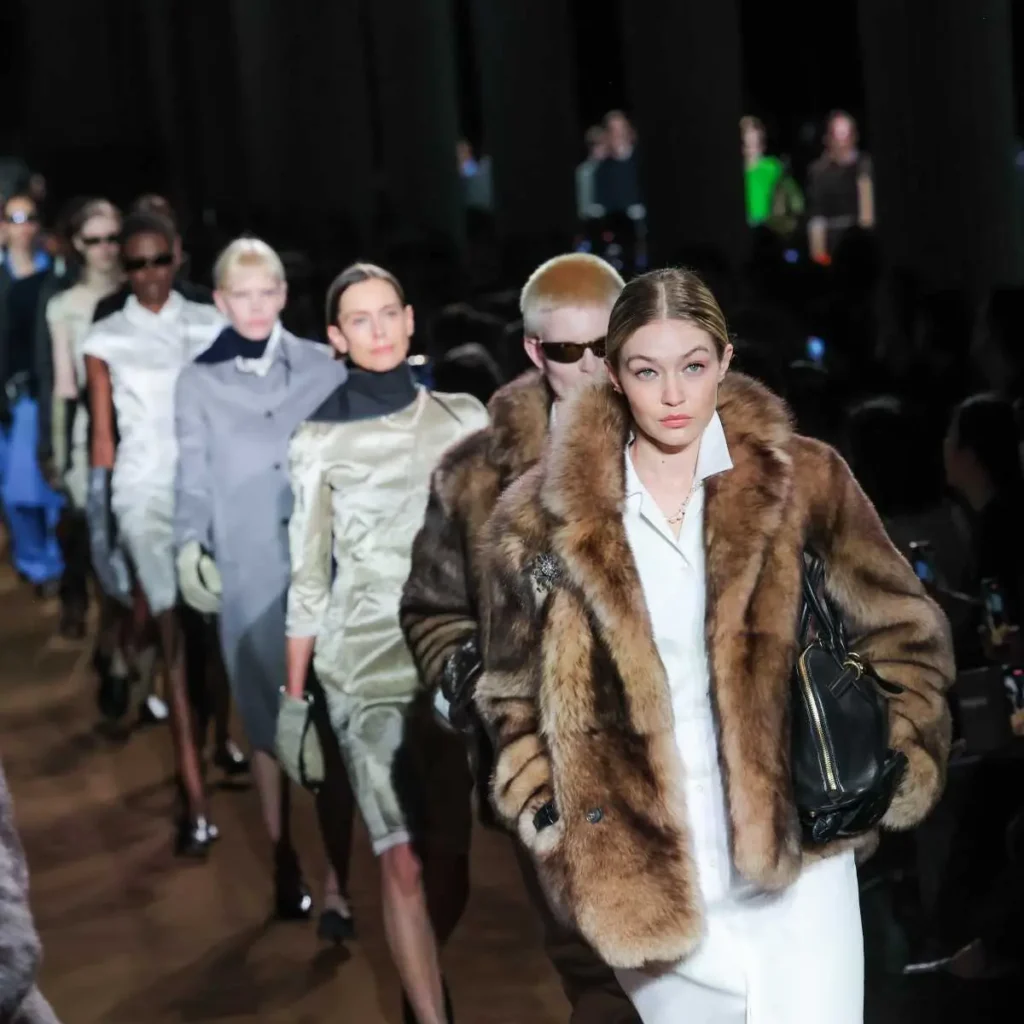 Image of a line of models for the Miu Miu fall 2024 collection