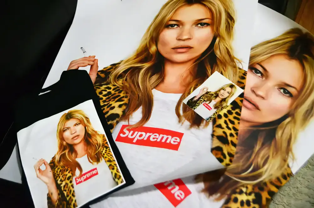 Close-up of the Supreme Kate Moss Photo Tee, featuring the supermodel in a leopard print jacket and the iconic box logo.